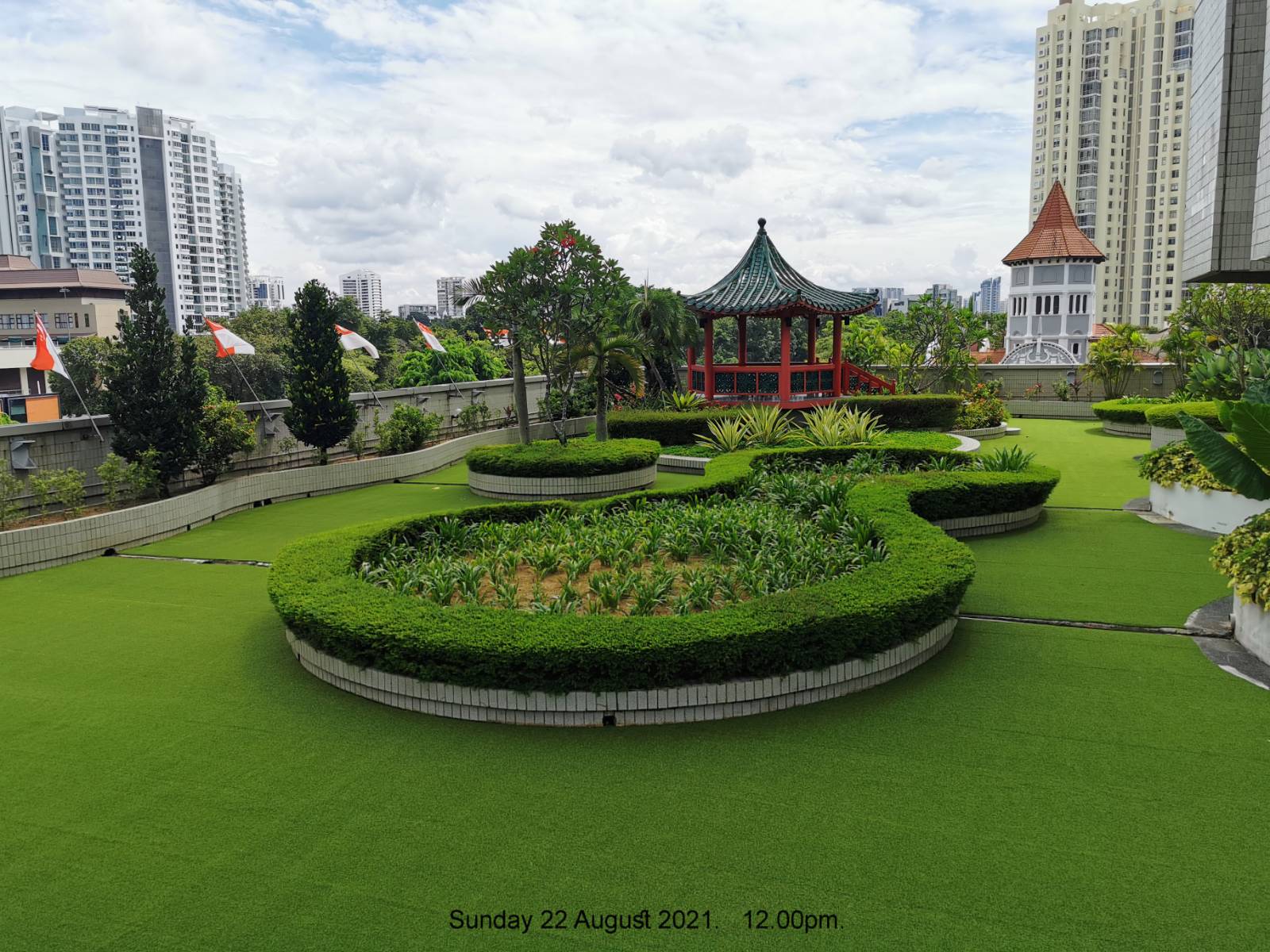 Re-turfed vivid green rooftop garden at Far East Plaza Residential, Singapore